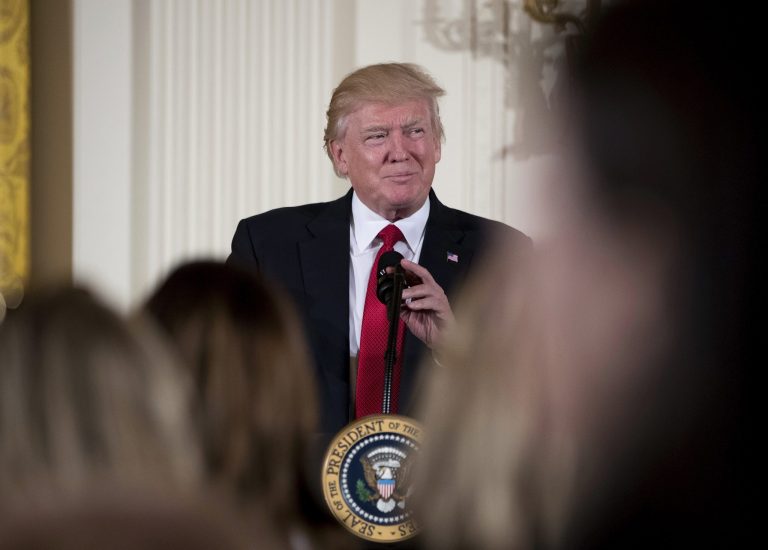 President Donald Trump pauses while speaking in the East Room of the White House in Washington. A new survey shows most Americans disapprove of President Donald Trump's performance, but they're more upbeat about how he's handling the economy. (AP Photo/Andrew Harnik, File)