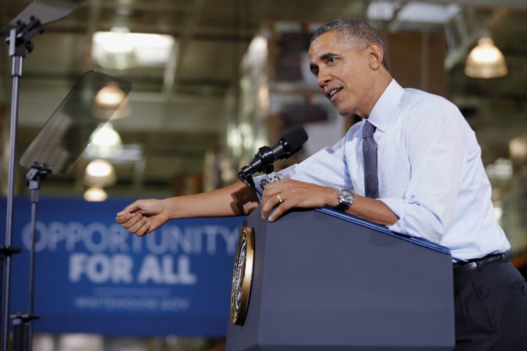 FILE - In this Jan. 29, 2014 file photo, President Barack Obama speaks about raising the minimum wage during a visit to a Costco store in Lanham, Md. 