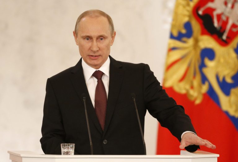 Russian President Vladimir Putin addresses the Federation Council in Moscow's Kremlin on Tuesday. (AP Photo/Alexander Zemlianichenko)