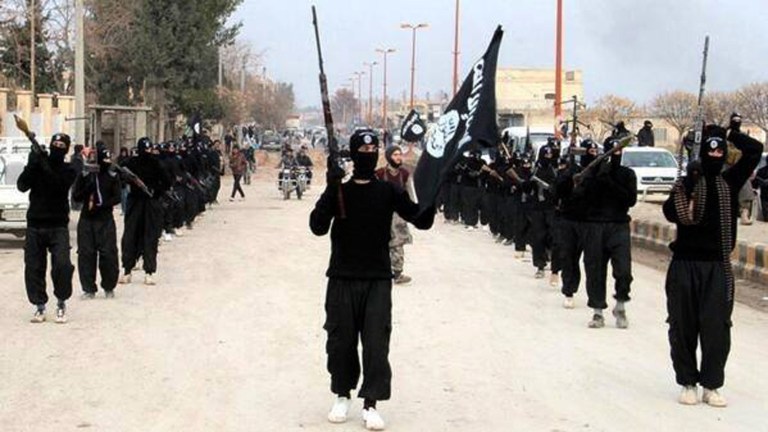 FILE - In this undated file image posted on a militant website on Tuesday, Jan. 14, 2014, which has been verified and is consistent with other AP reporting, fighters from the Islamic State group march in Raqqa, Syria. The Islamic State group is often described as the most fearsome jihadi outfit of all: a global menace outweighing al-Qaida, with armies trembling before its advance. But while the group has been successful at seizing parts of Iraq and Syria, it is no unstoppable juggernaut. (AP Photo/Militant Website, File)