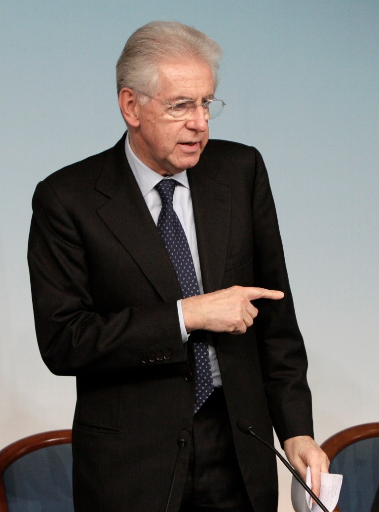   FILE - In this Dec. 6, 2012 file photo, Italian Premier Mario Monti gestures during a news conference at the end of a cabinet meeting, at the Chigi Palace government office, Rome. Premier Mario Monti told the Italian president Saturday, Dec. 8, 2012, he plans to resign following the sudden loss of support from Silvio Berlusconi's party, paving the way for early elections a year after the economist helped pull the country back from the brink of financial disaster. (AP Photo/Riccardo De Luca, File)  