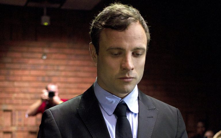 FILE In this file photo taken Monday, Aug. 19, 2013 double-amputee Olympian Oscar Pistorius, at the magistrates court in Pretoria, South Africa, when Pistorius was indicted on charges of murder and illegal possession of ammunition for the shooting death of his girlfriend on Valentine's Day. It was reported on Thursday, Jan. 23, 2014, that Oscar Pistorius' lawyers have been negotiating an out-of court settlement for nearly six months with representatives of the parents of slain girlfriend Reeva Steenkamp, which a legal expert says could be raised by prosecutors in the Olympic athlete's murder trial.  Lawyers for both sides said Thursday the negotiations are continuing and declined to comment on any details of a possible settlement, which media reports say could see the double-amputee runner pay in the region of $275,000 to Steenkamp's family.(AP Photo/Themba Hadebe, File)