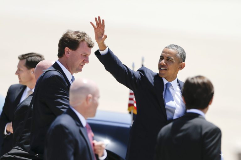 President Barack Obama waves to a crowd on the tarmac as he arrives on Air Force One Thursday, May 8, 2014, at Marine Corps Air Station Miramar in San Diego. Obama is scheduled to attend a political fundraiser during his brief stopover in San Diego. (AP Photo/Gregory Bull)