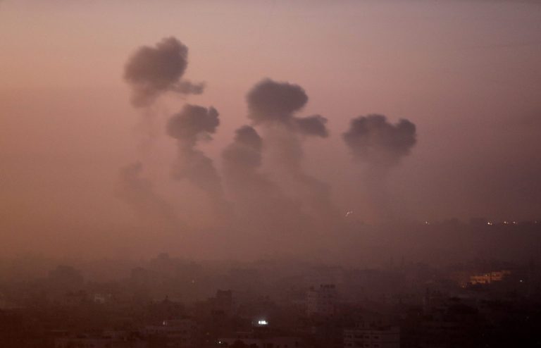 Smoke rises in the skyline from Israeli strikes in eastern Gaza City, early Wednesday, July 30, 2014, amid Israel's heaviest air and artillery assault in more than three weeks of Israel-Hamas fighting. (AP Photo/Khalil Hamra)