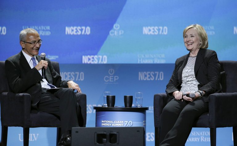 In this Sept. 4, 2014 photo, former Secretary of State Hillary Rodham Clinton takes questions from John Podesta, currently her campaign chairman. (AP Photo/John Locher)