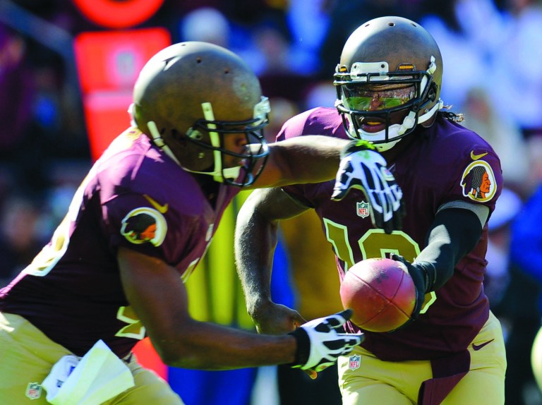 Richard Lipski/AP
Washington Redskins quarterback Robert Griffin III has thrown for 1,993 yards, eight touchdowns and three interceptions.