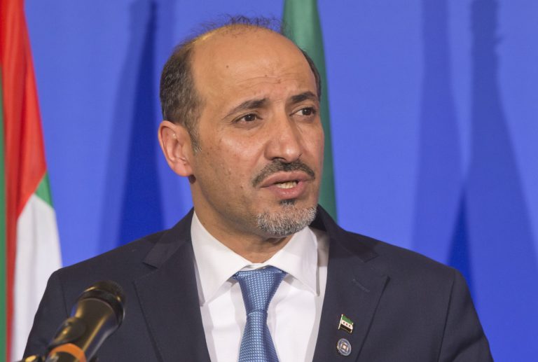 Syrian National Coalition Chief Ahmad al-Jarba speaks during a press conference at the foreign ministry in Paris on Jan. 12. Syria's opposition coalition has suspended its participation in this week's peace talks in Switzerland after the United Nations asked Iran to join the conference.ÃÂ (AP Photo/Michel Euler)