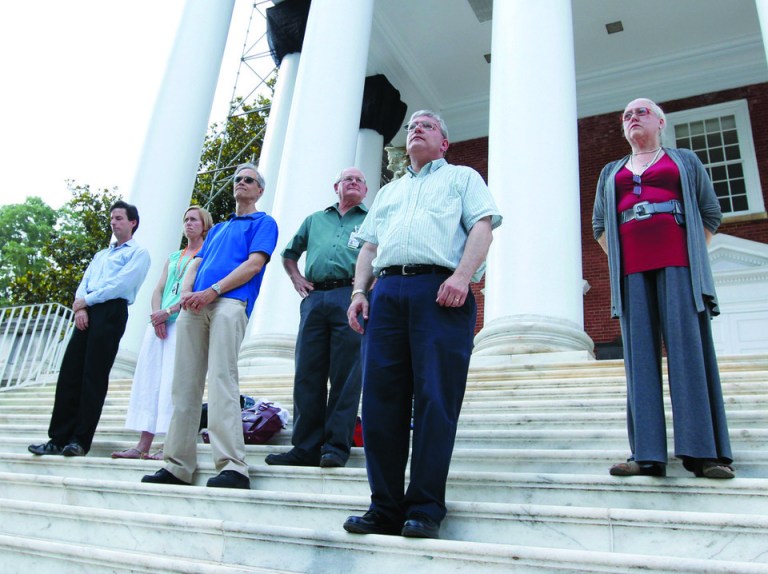 Members of the University of Virginia Faculty Senate Executive Council stand on the steps of the Rotunda, where hundreds gathered for a silent vigil in support of the reinstatement of ousted university President Teresa Sullivan Wednesday, June 20, 2012, in Charlottesville, Va. (AP Photo/The Daily Progress, Sabrina Schaeffer)