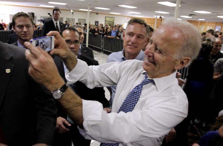 Vice President Joe Biden and Rep. Scott Peters, D-Calif., take a selfie at a campaign rally in San Diego at the International Association of Machinists and Aerospace Workers hall. Peters and opponent, Republican Carl Carl DeMaio are locked in a dead heat going into Tuesday's election. (AP Photo/U-T San Diego, Howard Lipin, Pool)