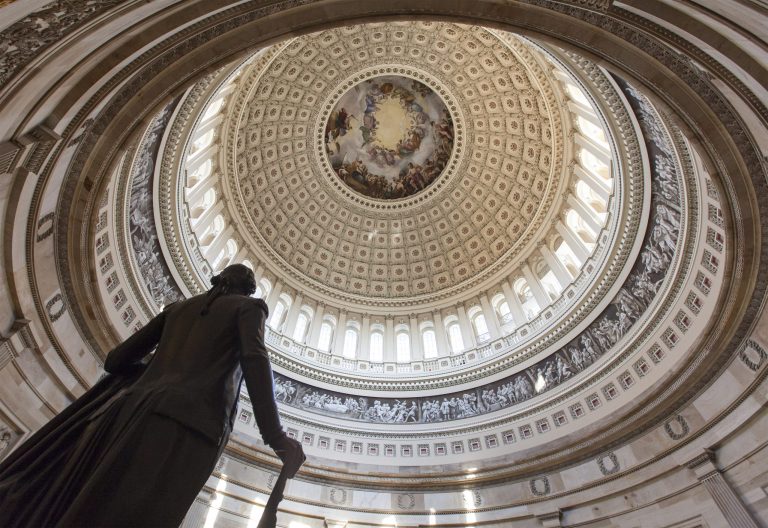 The Capitol Rotunda looms over the statue of George Washington on Capitol Hill in Washington, Monday, Jan. 27, 2014, as the House and Senate resume work in Washington. President Barack Obama will deliver his State of the Union address Tuesday night to a joint session of Congress.  (AP Photo/J. Scott Applewhite)
