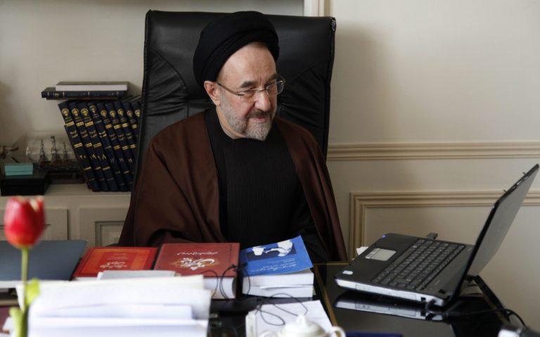 In this undated photo released by office of former Iranian President Mohammad Khatami, Mohammad Khatami, watches a video on his laptop, at his office, in Tehran, Iran. Many reformists are expected to sit out the June 14 voting in a silent protest over the crackdowns that have left them leaderless and demoralized. Others unwilling to boycott the election are rallying around a last-ditch call for help to Khatami, who is seen increasingly as their only credible hope at the ballot box. (AP Photo/Office of Mohammad Khatami, Asghar Khaksar)