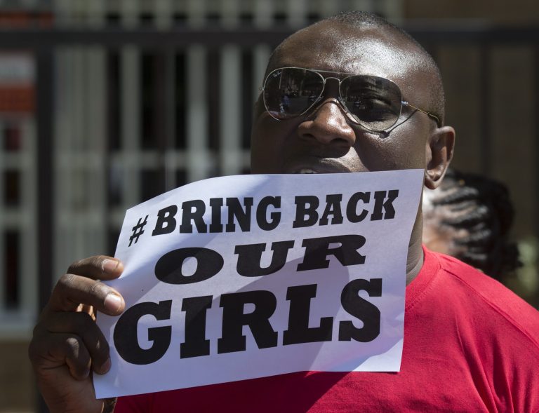 A Nigerian, resident in Spain protests outside the Nigerian embassy in Madrid, Spain, Friday, May 16, 2014 in support of the kidnapped school girls in Abuja, Nigeria. Boko Haram insurgents on April 15 abducted more than 300 students from the Chibok Government Girls Secondary School. Police say 53 managed to escape and 276 remain in captivity. (AP Photo/Paul White)