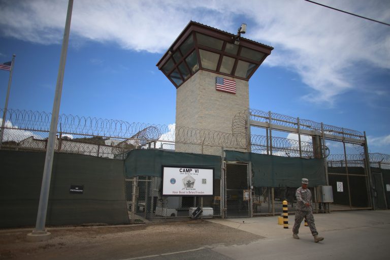 A military officer walks from the entrance to Camp VI at the U.S. military prison for 'enemy combatants' on June 25, 2013 in Guantanamo Bay, Cuba. (Photo by Joe Raedle/Getty Images)