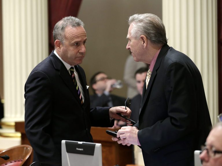 Senate President Pro Tem Darrell Steinberg, D-Sacramento, talks with Sen. Jim Neilsen, R-Gerber, vice chairman of the Senate Budget Committee at the Capitol in Sacramento, Calif., Thursday, June 12, 2014.  Lawmakers are expected to vote on the state budget bill,  for the 2014-15 fiscal year, which starts July 1, Sunday, the constitutional deadline of lawmakers to pass a balanced spending plan and avoid forfeiting their pay. (AP Photo/Rich Pedroncelli)