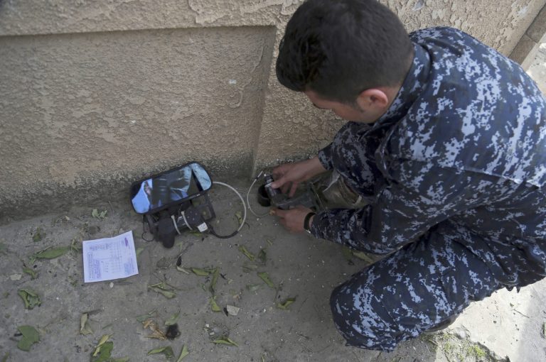 The video is about just over two minutes long, and was edited from hours of overhead surveillance by a U.S. drone flying over West Mosul in the March 29. (AP Photo/Khalid Mohammed)