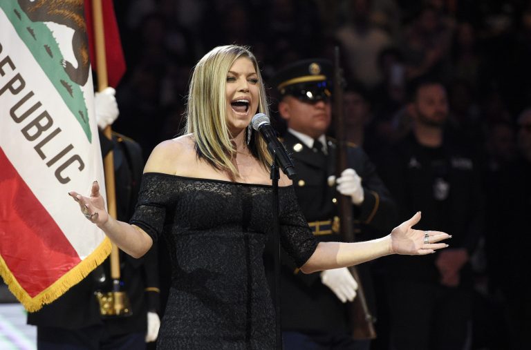 The Black Eyed Peas lead signer-turned-solo performer sang a blues rendition of the Star-Spangled Banner that at times had sexual undertones to it. (AP Photo/Chris Pizzello)