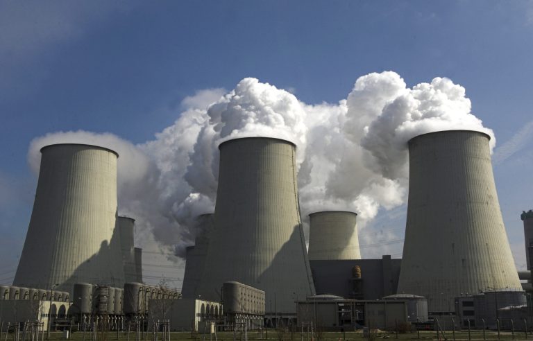 Steam rises up from the cooling towers of a brown coal power station in Germany in April 2007. (AP Photo/Sven Kaestner)