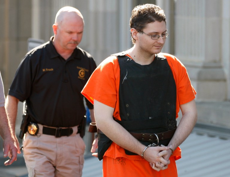   FILE - This April 23, 2012, file photo shows Kevin Sweat being escorted from the courthouse in Okemah, Okla. Sweat is accused of killing two young girls in 2008 and is scheduled to be formally arraigned Tuesday, June 5, 2012, on a first-degree murder count stemming from the July death of his girlfriend. (AP Photo/Sue Ogrocki, File)  