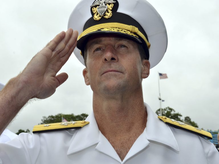 In this July 26, 2013 photo released by the U.S. Navy, Rear Adm. Kenneth Perry, commander of all U.S. attack submarines based on the East Coast, participates in a retirement ceremony at the Submarine Force Library and Museum on the Naval Submarine Base New London in Groton, Conn. Perry, who is retiring on Aug. 22, 2014, may be the last flag officer to be based at the country's original sub base due to a consolidation that eliminated his submarine group. The attack subs will remain in Groton, along with the Navy's sub school. (AP Photo/U.S. Navy)
