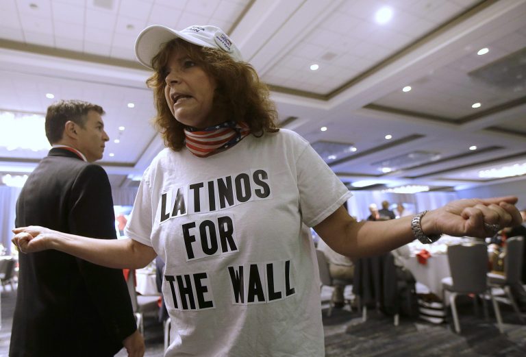 Republican presidential candidate Donald Trump supporter Luisa Aranda gestures as she is interviewed before Trump spoke at the California Republican Party 2016 Convention in Burlingame, Calif., Friday, April 29, 2016. (AP Photo/Jeff Chiu)