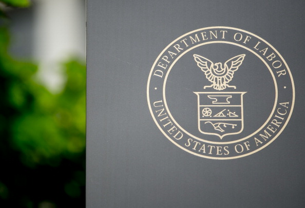 The U.S. Department of Labor seal is seen on a sign outside of the headquarters in Washington, D.C., U.S., on Wednesday, July 3, 2013. (Andrew Harrer/Bloomberg via Getty Images)