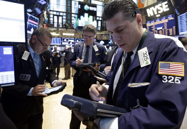 Trader William McInerney works on the floor of the New York Stock Exchange Wednesday, April 23, 2014.  A six-day rally on the stock market is petering out as some U.S. companies report earnings that disappoint investors. (AP Photo/Richard Drew)