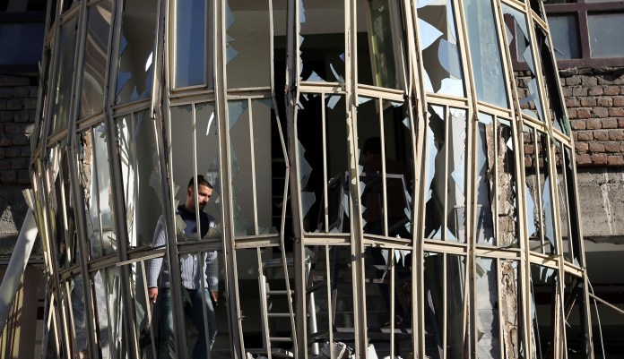 The scene of a suicide attack on a Shiite cultural center in Kabul, Afghanistan. "The United States strongly condemns today's barbaric attack at a cultural and social center in Kabul, Afghanistan, and offers its deepest condolences to the victims and their families," White House press secretary Sarah Sanders said. (AP Photo/ Rahmat Gul)