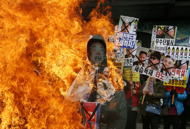 FILE - In this April 15, 2013 file photo, South Korean protesters burn effigies of North Korean leader Kim Jong-Un, and late leaders Kim Jong Il and Kim Il Sung at an anti-North Korea protest on the birthday of Kim Il Sung in Seoul, South Korea. North Korea lashed out anew Tuesday, April 16, 2013 at South Korea over the small public protest, saying it would not hold talks with its southern neighbor unless it apologized for anti-North Korean actions 