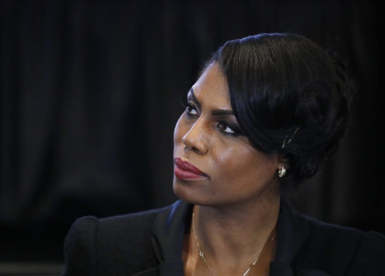 The argument started when the moderator, Ed Gordon, asked Omarosa Manigault about President Trump's much-criticized comments last month in which he suggested police should be rougher on suspects they arrest. (AP Photo/Manuel Balce Ceneta)