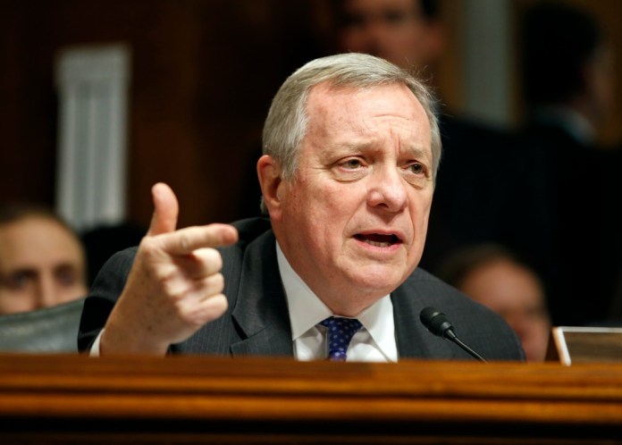"Here's what it boils down to: The presumption, I believe, should be in favor of keeping guns out of a person's hand if they're on the list," Senate Minority Whip Dick Durbin told the Examiner. (AP Photo)