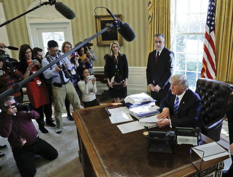 President Donald Trump, accompanied by Intel CEO Brian Krzanich, speaks to members of the media during his meeting in the Oval Office of the White House in Washington, Wednesday, Feb. 8, 2017. Krzanich announced a $7 billion investment in advanced factory in Chandler, Ariz. (AP Photo/Pablo Martinez Monsivais)