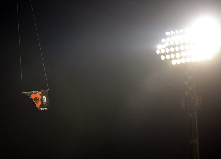 A drone with an Albanian flag banner flies over Partizan stadium during the Euro 2016 Group I qualifying match between Serbia and Albania in Belgrade, Serbia, Tuesday, Oct. 14, 2014. The match was abandoned. (AP Photo/Darko Vojinovic)