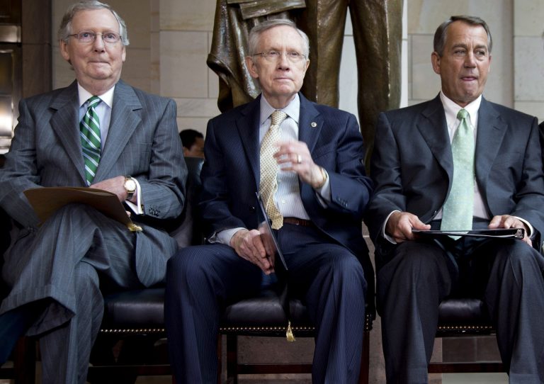 Senate Minority Leader Mitch McConnell, R-Ky., left, sits between Majority Leader Harry Reid, D-Nev., center, and House Speaker John Boehner, R-Ohio. (AP Image)