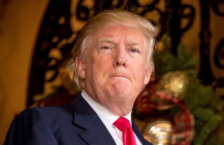 Donald Trump issued his first critical tweets of the New York Times and Washington Post as president of the United States on Saturday. (AP Photo/Andrew Harnik)