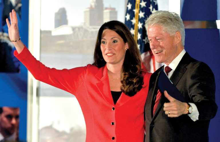 Democratic Senate challenger Alison Lundergan Grimes left, speaks with former Presidet Bill Clinton as they are introduced at a fundraiser at the Galt House Hotel, Tuesday, Feb. 25, 2014, in Louisville, Ky. (AP Photo/Timothy D. Easley)
