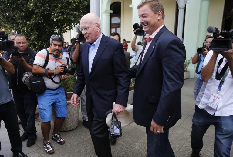 Sen. Patrick Leahy, D-Vt. and Sen. Dean Heller, R-Nev., right, leave a hotel after a press conference in Havana, Cuba, Saturday, June 27, 2015. The U.S. Senate bipartisan delegation spoke to the media during their visit to Cuba as the two countries move toward reopening embassies and restoring long-strained diplomatic ties. (AP Photo/Desmond Boylan)