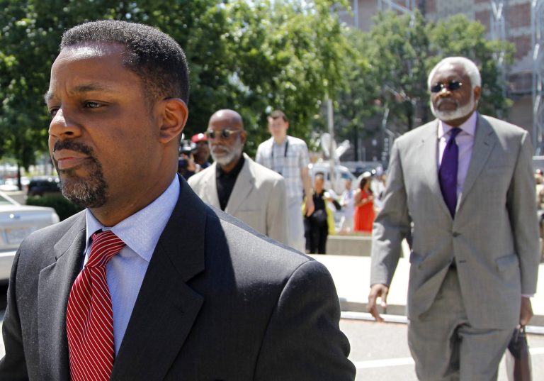   Former Washington, D.C. City Council Chairman Kwame Brown, left, followed by his attorney Frederick D. Cooke Jr., leaves federal court in Washington, Friday, June 8, 2012, after pleading guilty to federal bank fraud. (AP Photo/Haraz N. Ghanbari)  