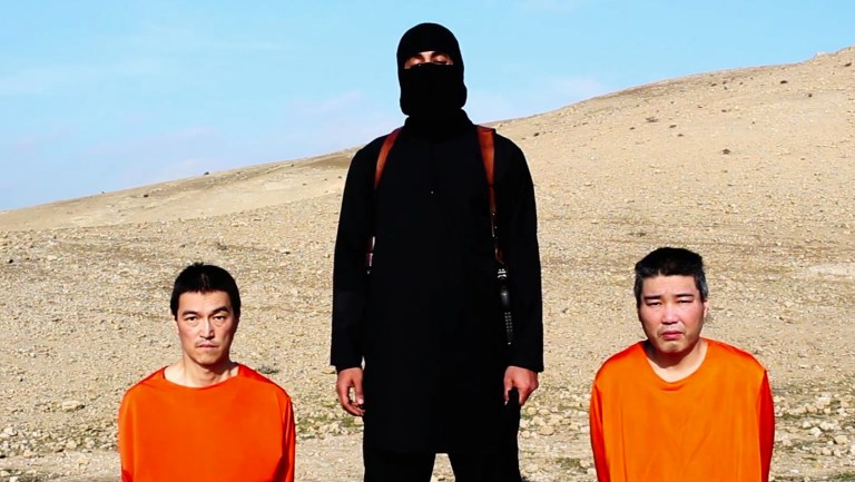 This image taken from an online video released by the Islamic State group's al-Furqan media arm on Tuesday, Jan. 20, 2015, purports to show the group threatening to kill two Japanese hostages that the militants identify as Kenji Goto Jogo, left, and Haruna Yukawa, right, unless a $200 million ransom is paid within 72 hours. Japan's Foreign Ministry's anti-terrorism section has seen the video and analysts are assessing it, a ministry official said on Tuesday. (AP Photo)