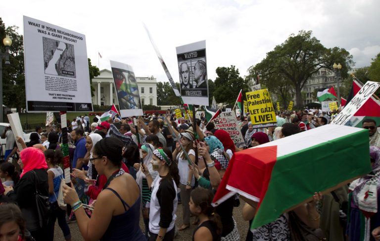 Demonstrators in support of ending the violence in Gaza march in front of the White House in Washington, Saturday, Aug. 2, 2014. The Obama administration condemned 