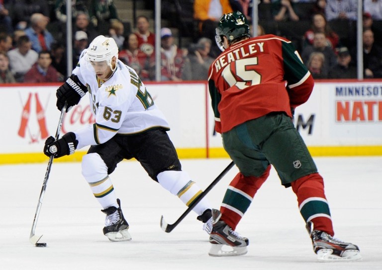 ST PAUL, MN - MARCH 13: Mike Ribeiro #63 of the Dallas Stars controls the puck against Dany Heatley #15 of the Minnesota Wild during the first period on March 13, 2012 at Xcel Energy Center in St Paul, Minnesota. The Stars defeated the Wild 1-0. (Photo by Hannah Foslien/Getty Images)