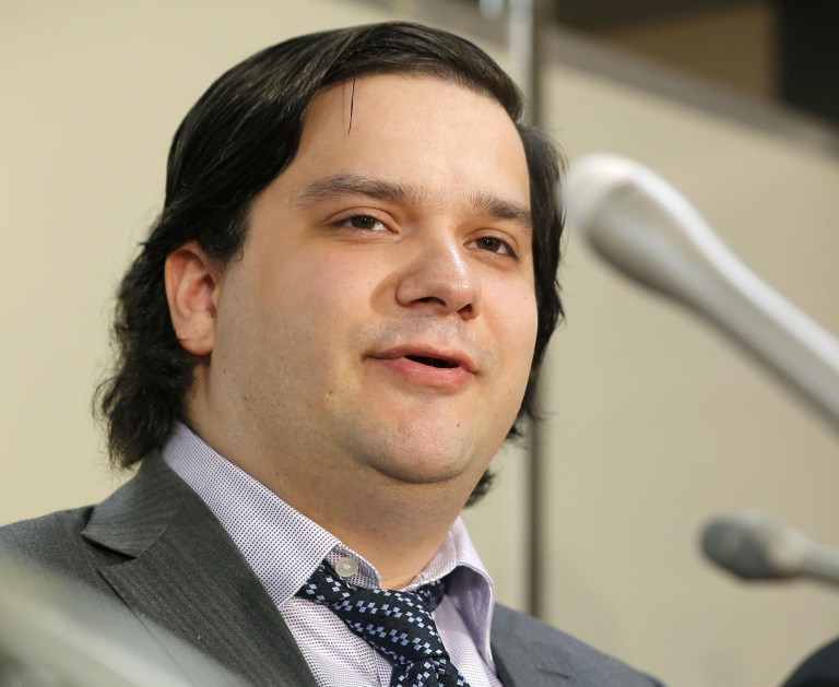 Mt. Gox CEO Mark Karpeles speaks at a press conference at the Justice Ministry in Tokyo Friday night, Feb. 28, 2014. The Mt. Gox bitcoin exchange in Tokyo filed for bankruptcy protection, acknowledging that a significant amount of the virtual currency had gone missing. Karpeles appeared before Japanese TV news cameras Friday, bowing deeply for several minutes. He said a weakness in the exchange's systems was behind the massive loss of the virtual currency. (AP Photo/Kyodo News) JAPAN OUT, MANDATORY CREDIT