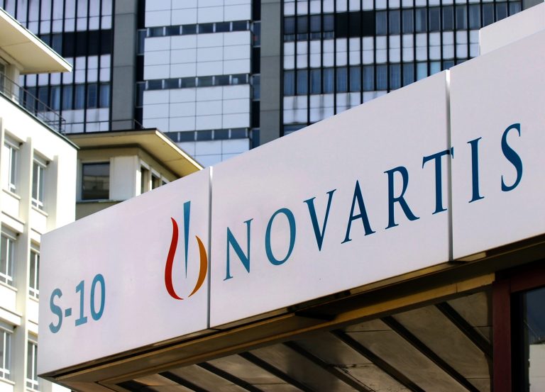FILE - The Aug. 12, 2005 file photo shows the logo of Swiss company Novartis in Basel, Switzerland. Swiss pharmaceutical giant Novartis AG announced a series of multibillion-dollar deals Tuesday, April 22, 2014 with other major pharmaceutical companies that it said would reduce sales but boost profitability, while affecting some 15,000 of its employees globally.  (AP Photo/Keystone, Steffen Schmidt)