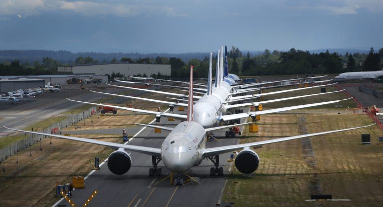 FILE - This June 18, 2013 file photo shows a line of Boeing 787 Dreamliners waiting to be delivered on a closed runway at Paine Field near Boeing's Everett, Wash. assembly plant. Boeing reports quarterly earnings on Wednesday, April 23, 2014.