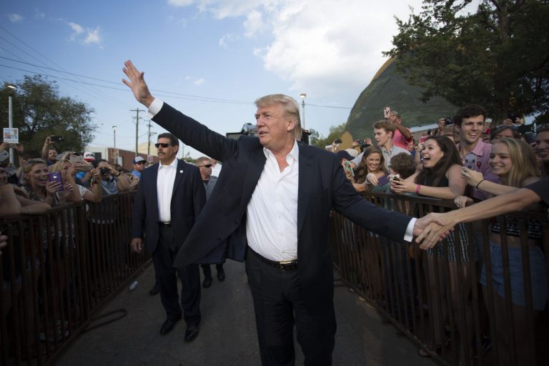 Republican presidential candidate Donald Trump greets supporters before he delivers his message during a campaign rally at the state fair in Oklahoma City. A poll finds voters back his anti-Muslim message. (AP Photo/J Pat Carter, File)