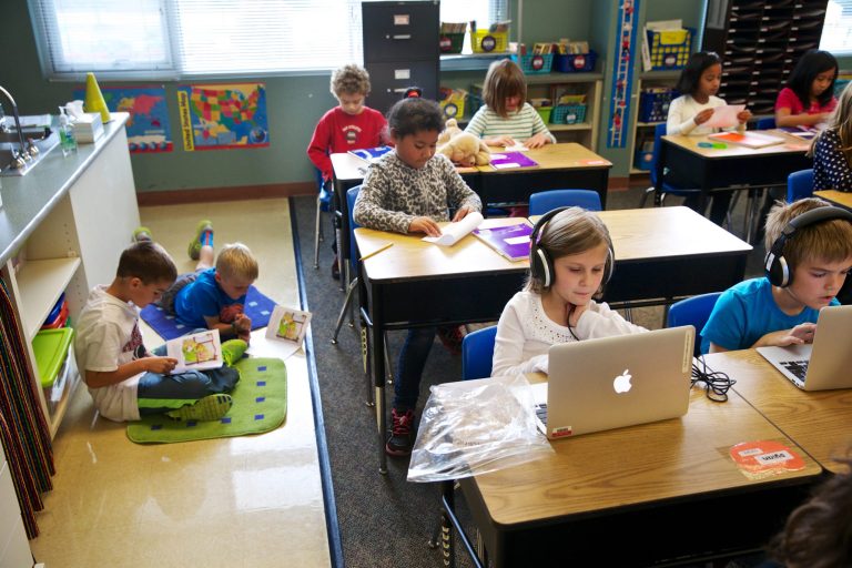 In this Oct. 9, 2013 photo, third graders in teacher Janell Cooke's class read with other students and work on concentrated vocabulary at Tualatin Elementary in Tualatin, Ore. (AP File)