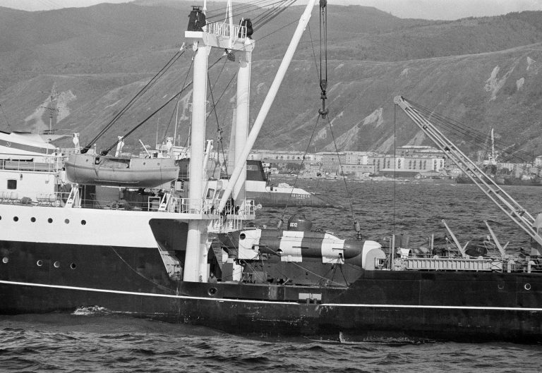 FILE - In this Sept. 27, 1983 file photo, a soviet mini-submarine used to search for debris from Korean Air Lines flight 007, shot down Sept. 1, 1983 near Sakhalin Island, rests on the deck of a conventional tender vessel in Nevel'sk, Sakhalin Island, in the East Sea off Russia. The plane, with 269 passengers and crew, was shot down by a Russian fighter jet west of Sakhalin Island as it strayed into prohibited Soviet airspace. The plane was en route from New York to Seoul on Sept. 1, 1983, following a route that took it over Alaska before crossing the Pacific Ocean. (AP Photo/Neal Ulevich, File)