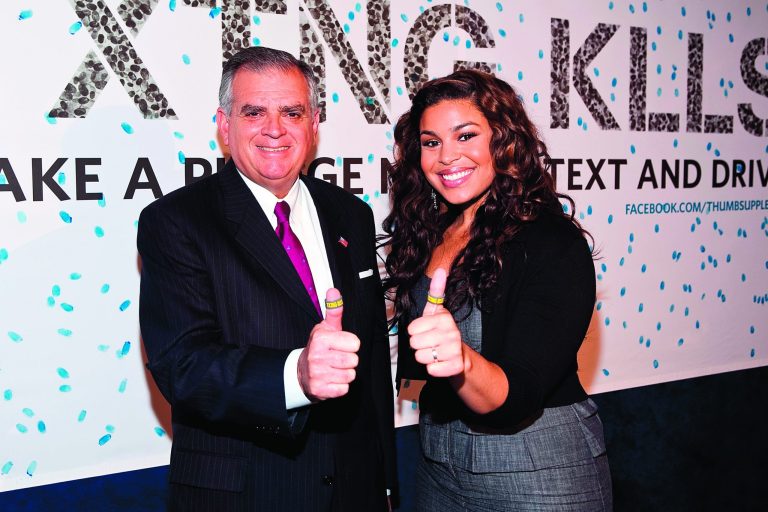 Secretary of Transportation Ray LaHood, shown with American Idol-winner Jordin Sparks, is winning the support of states and cops to add driver distractions as a cause on crash reports. (Photo by Paul Morigi/Getty Images for Allstate)