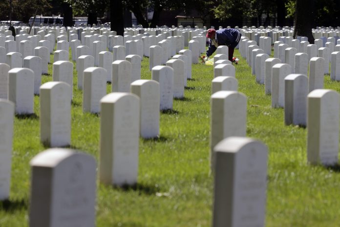 A Texas World War II veteran attempting to visit the graves of his fellow soldiers who participated in the D-Day invasion found the gates locked for the government shutdown, according to Rep. Steve Stockman, R-Texas. (AP/Mel Evans)