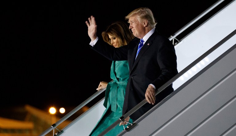President Trump, accompanied by first lady Melania Trump, waves as they walk down the steps of Air Force One after arriving at Warsaw Chopin Airport, Wednesday, July 5, 2017. (AP Photo/Evan Vucci)