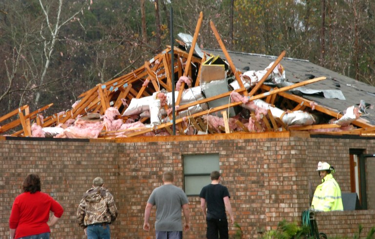   A house in Tioga, La., is severely damaged after an apparent tornado tore through the area Tuesday, Dec. 25, 2012. (AP Photo/The Daily Town Talk, Melinda Martinez) NO SALES  